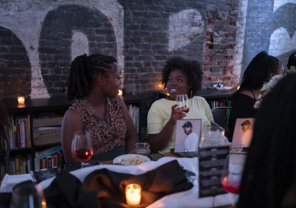Guests talking over wine at a Nosey Palate tasting